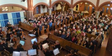 Dirigention zwischen Orchester und Publikum